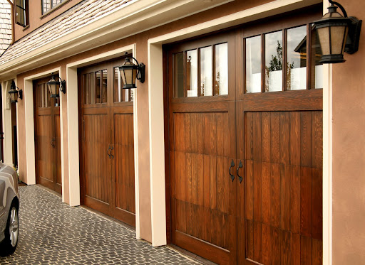 A luxury home with wood garage door replacement panels