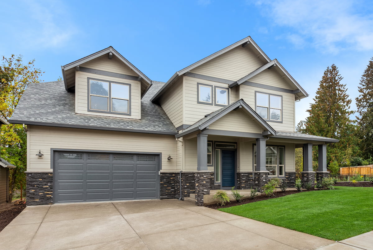 Front of two-story home with gray garage door